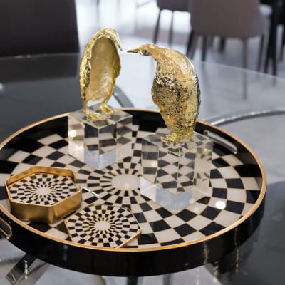 Gold Penguin Sculptures in our Showroom